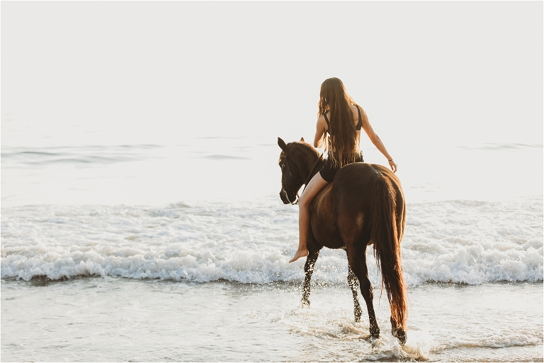 Santa Barbara Equine Session on the beach with California Equine Photographer Elizabeth Hay Photography with a girl and her black horse. 