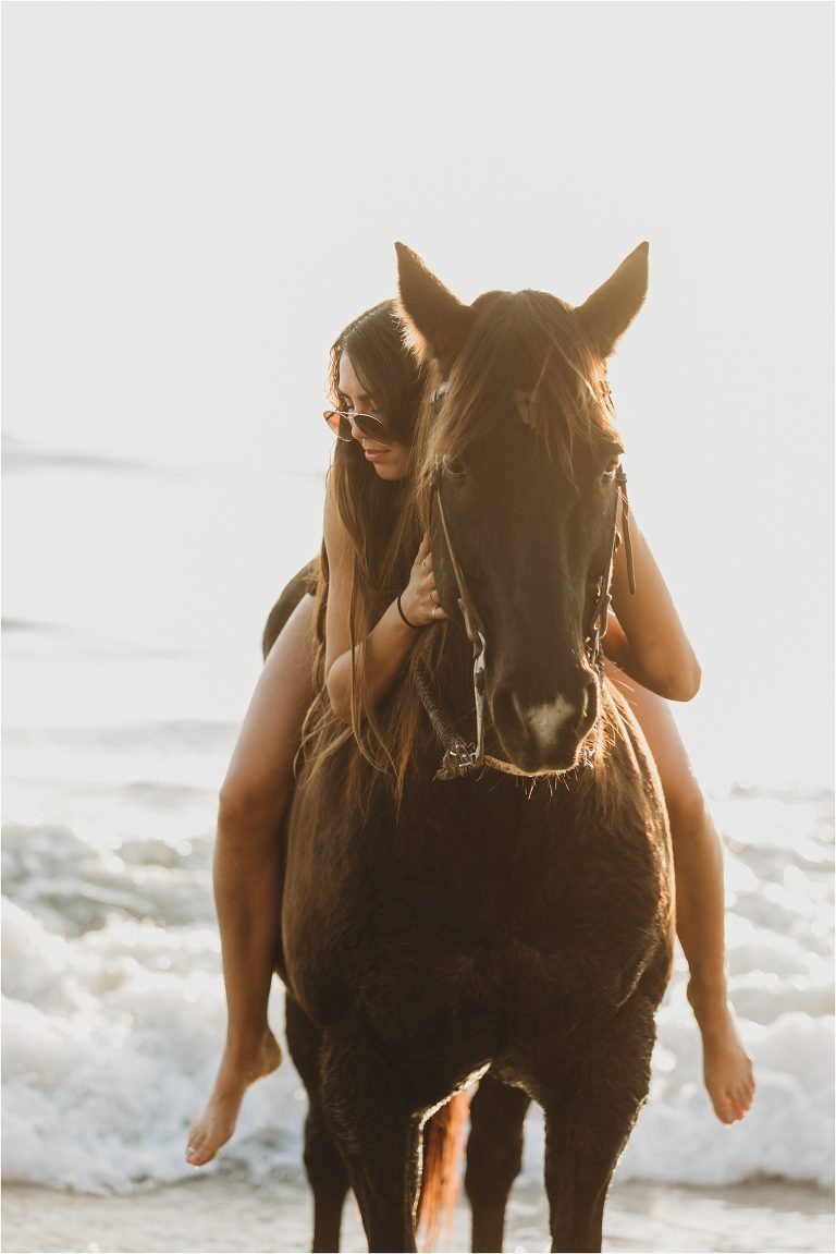 Santa Barbara Equine Session on the beach with California Equine Photographer Elizabeth Hay Photography with a girl hugging her horse. 