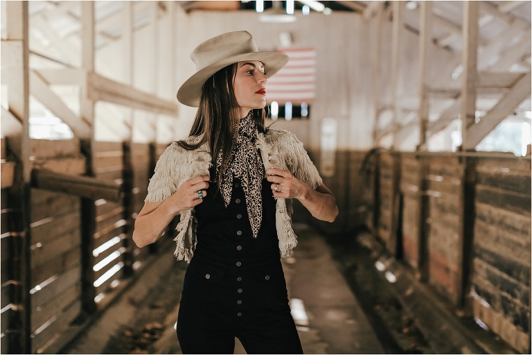 Western Fashion Style Inspo on the farm with Lindsay Branquinho in an old dairy barn and an American Flag by Elizabeth Hay 