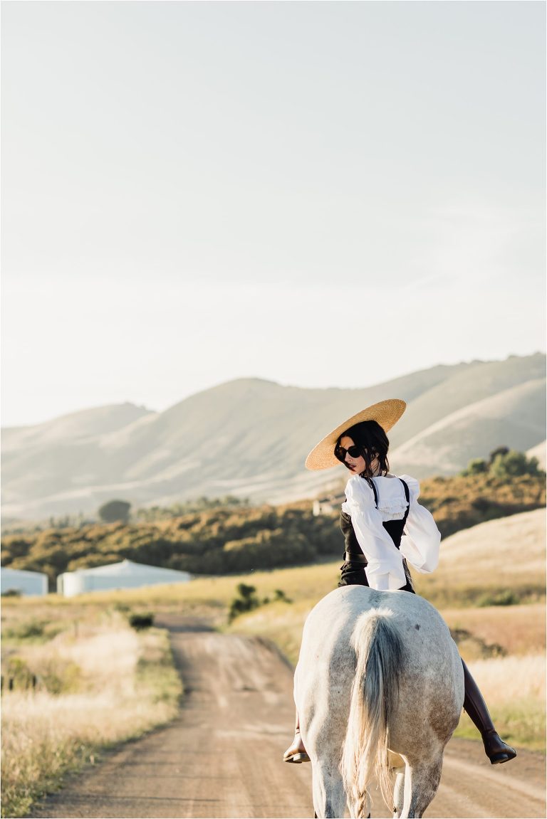 woman riding grey horse on Nipomo back road by California Equine Photographer Elizabeth Hay 