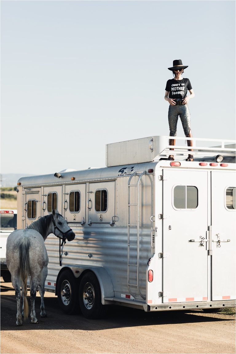 Equine Photographer Milton Menasco photo shoot in Nipomo California by Elizabeth Hay Photography woman standing on top of horse trailer