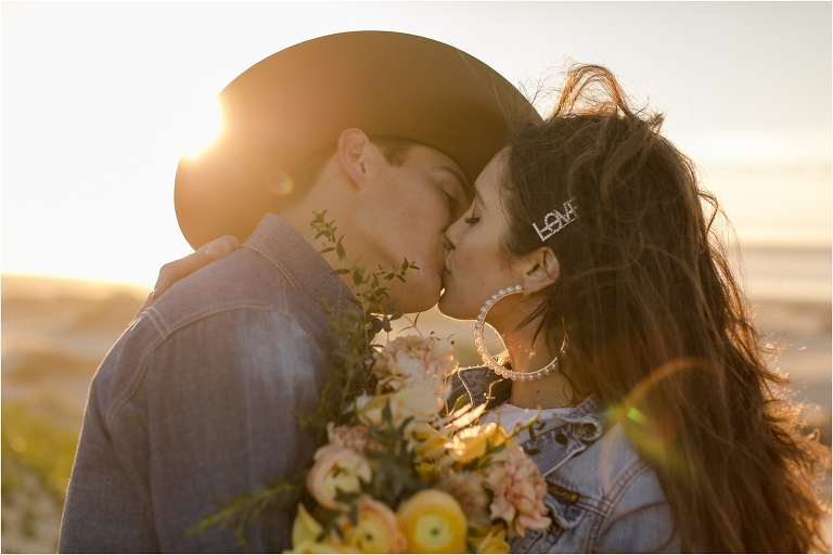 western couple kissing during engagement session at Morro Rock by California Equine Photographer Elizabeth Hay Photography of Annie and Clayton