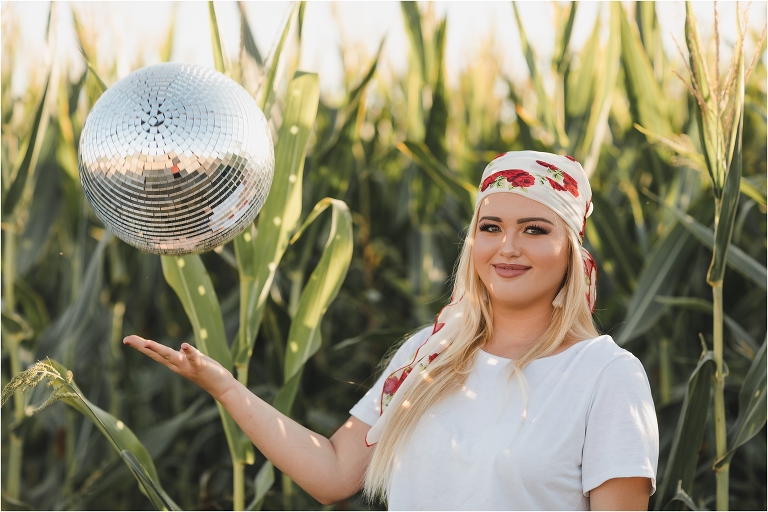 Buck Wild Rags shoot in a corn field with a disco ball by Elizabeth Hay Photography. 