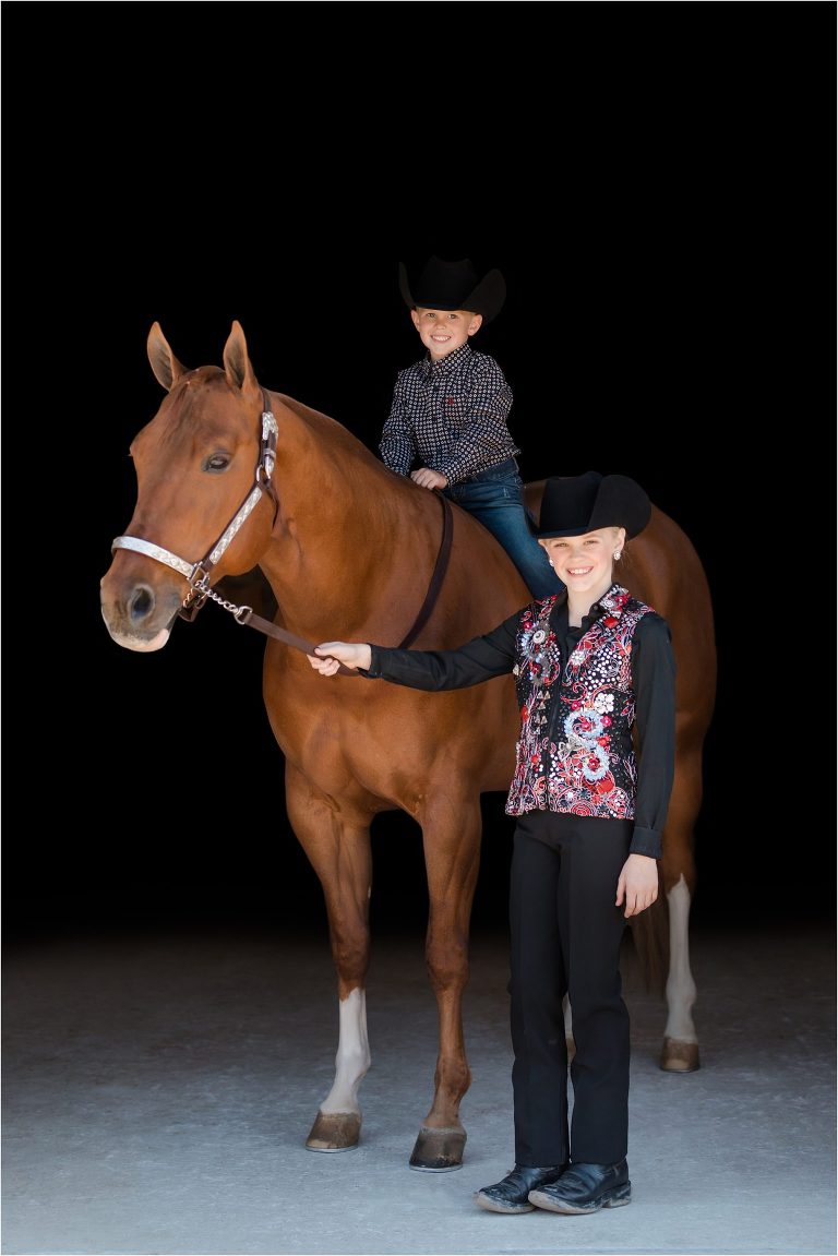 kids and chestnut mare black background portrait by California Equine Photographer Elizabeth Hay Photography. 