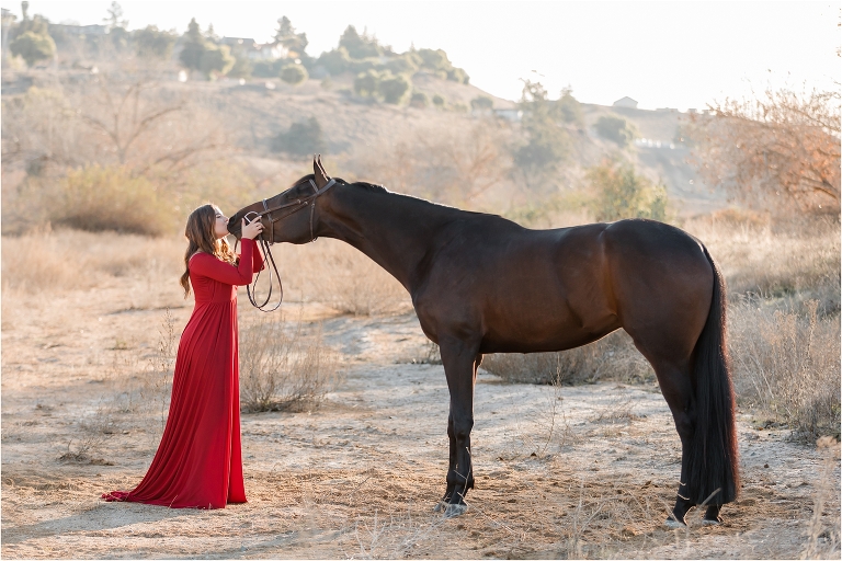 California Horse Photography Shoot at Wheeler Performance Horses in Hollister California by Elizabeth Hay Photography of girl kissing horse in dry river bed. 