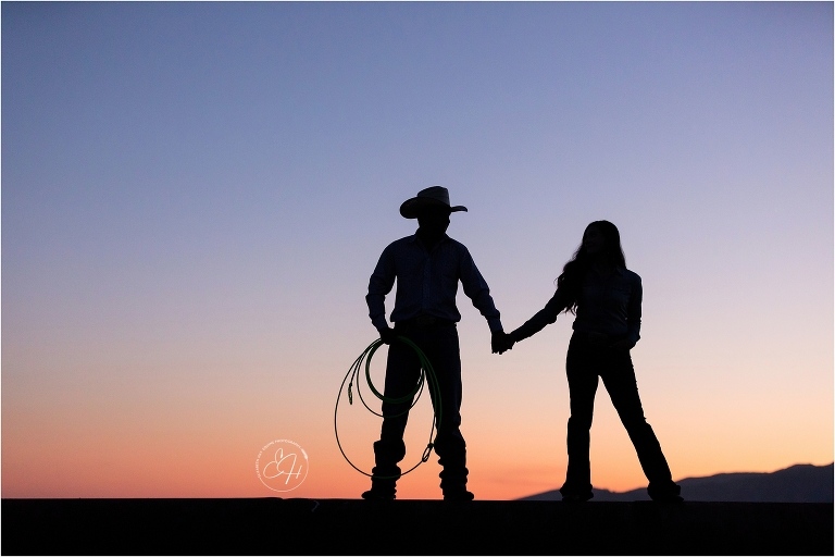 sunset silhouette of western couple by California Horse Photographer Elizabeth Hay Photographer