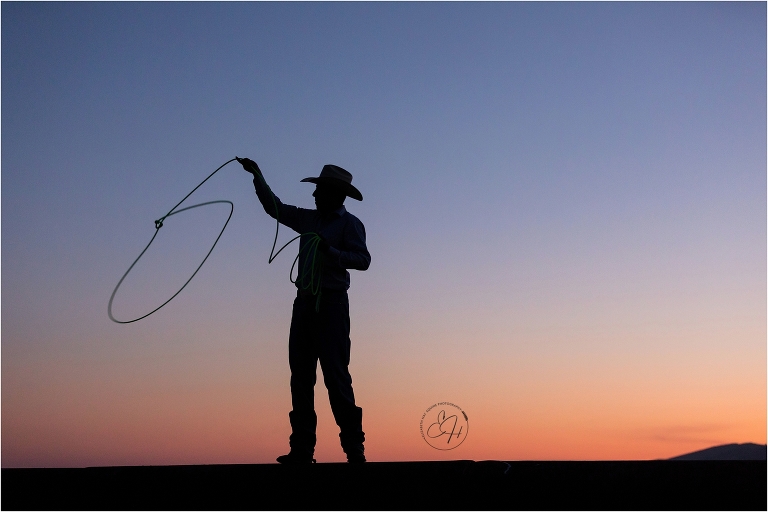 sunset silhouette of a cowboy roping by California Horse Photographer Elizabeth Hay Photographer