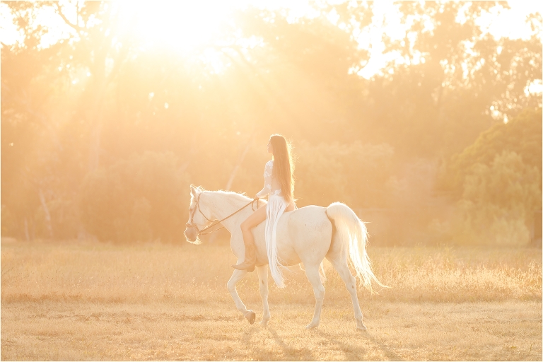 Ethereal equine photo session with woman riding white horse in Santa Barbara by California Equine Photographer Elizabeth Hay Photography.
