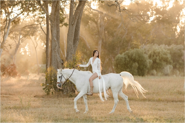 Ethereal equine photography session with woman riding white horse in Santa Barbara by California Equine Photographer Elizabeth Hay Photography.