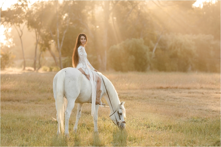 Ethereal equine photo shoot with woman riding grey horse in Santa Barbara by California Equine Photographer Elizabeth Hay Photography.
