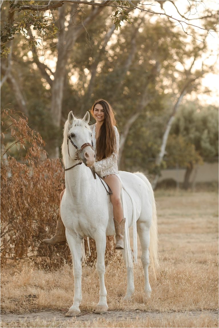 woman riding white mare in Santa Barbara by California Horse Photographer Elizabeth Hay Photography.