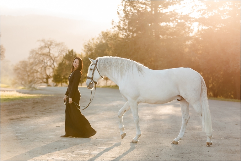 Woman wearing a black dress and white horse by California Horse Photographer Elizabeth Hay Photography.