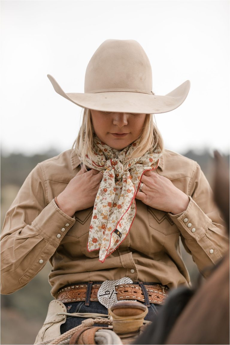 cowgirl tying on her wild rag at a Western Wild Rags Photoshoot with Buck Wild Rags in Bakersfield by California Horse Photographer Elizabeth Hay Photography.