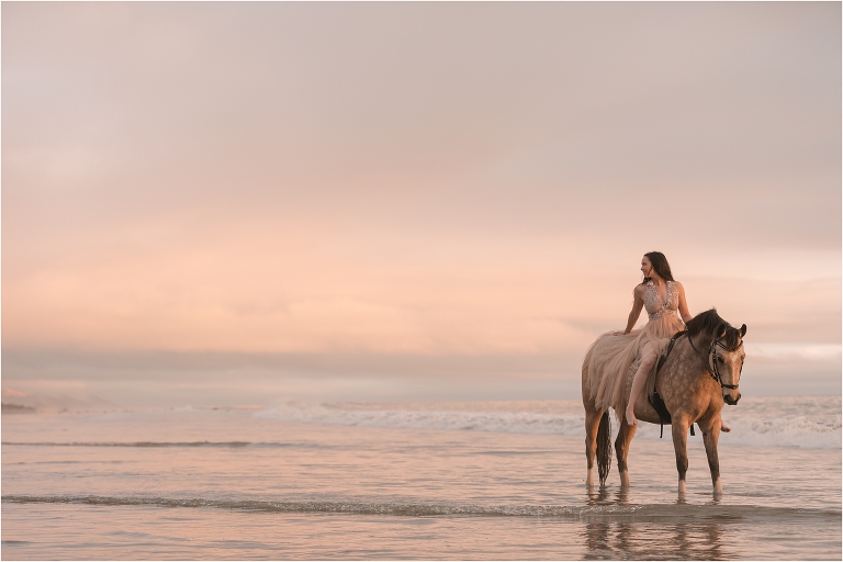 Equine Beach Photo Shoot with Britt and Louie standing serenely in the tides by California Equine Photographer Elizabeth Hay Photography.