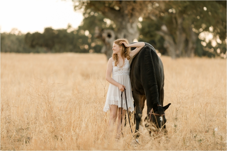 San Luis Obispo Equine photographer session with Sasha and her show jumper gelding in a golden field by California Equine Photographer Elizabeth Hay Photography