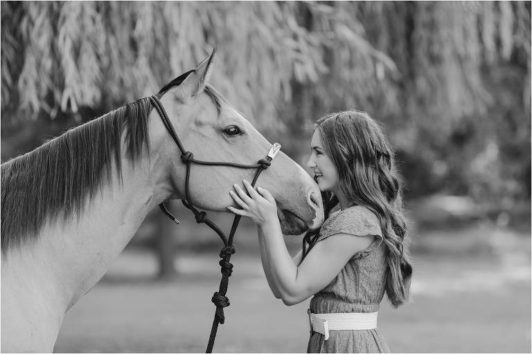 Senior Equine Photography session with California Equine Photographer Elizabeth Hay Photography of Shae kissing her buckskin horse.
