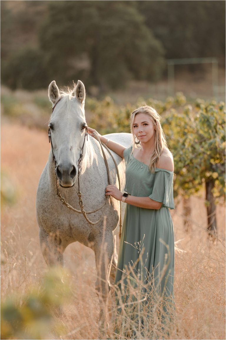 Central Coast Equine Photo session with Shayna and her grey horse in a vineyard by California Equine Photographer Elizabeth Hay Photography.